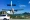 Plane lands over a roundabout to St. Barts Airport